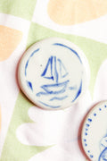 Marina Round Ceramic Magnet in Blue Sailboat
