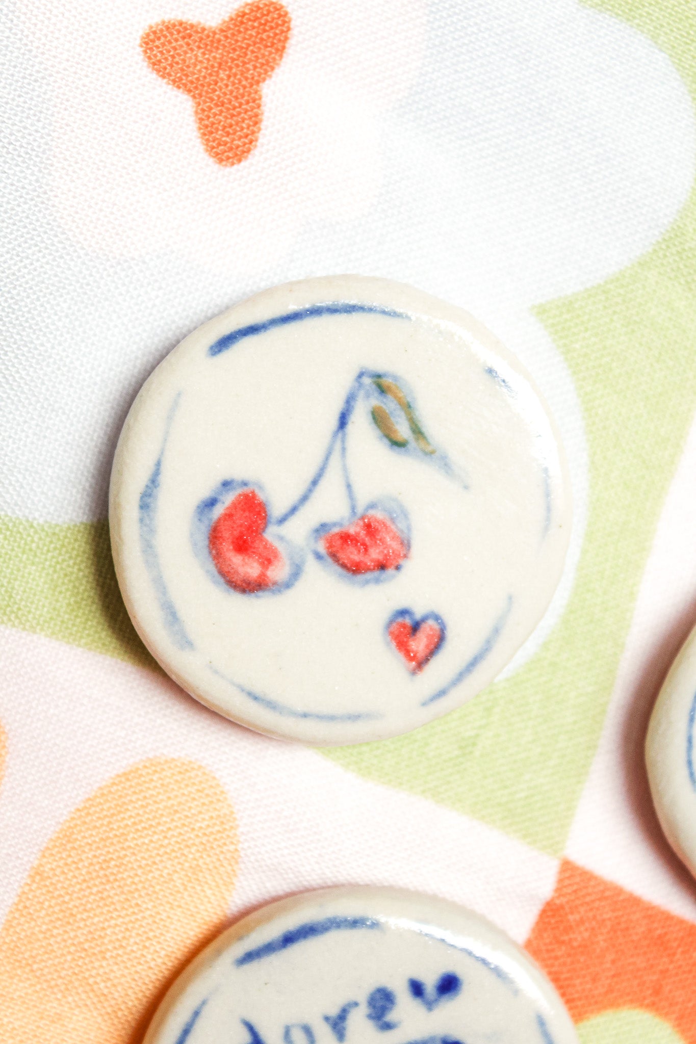 Lulu Round Ceramic Magnet in Red Cherry