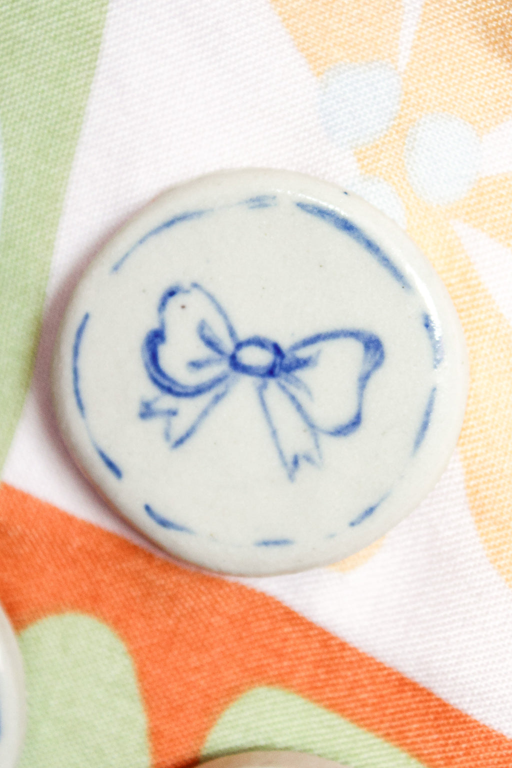 Lulu Round Ceramic Magnet in Blue Bow